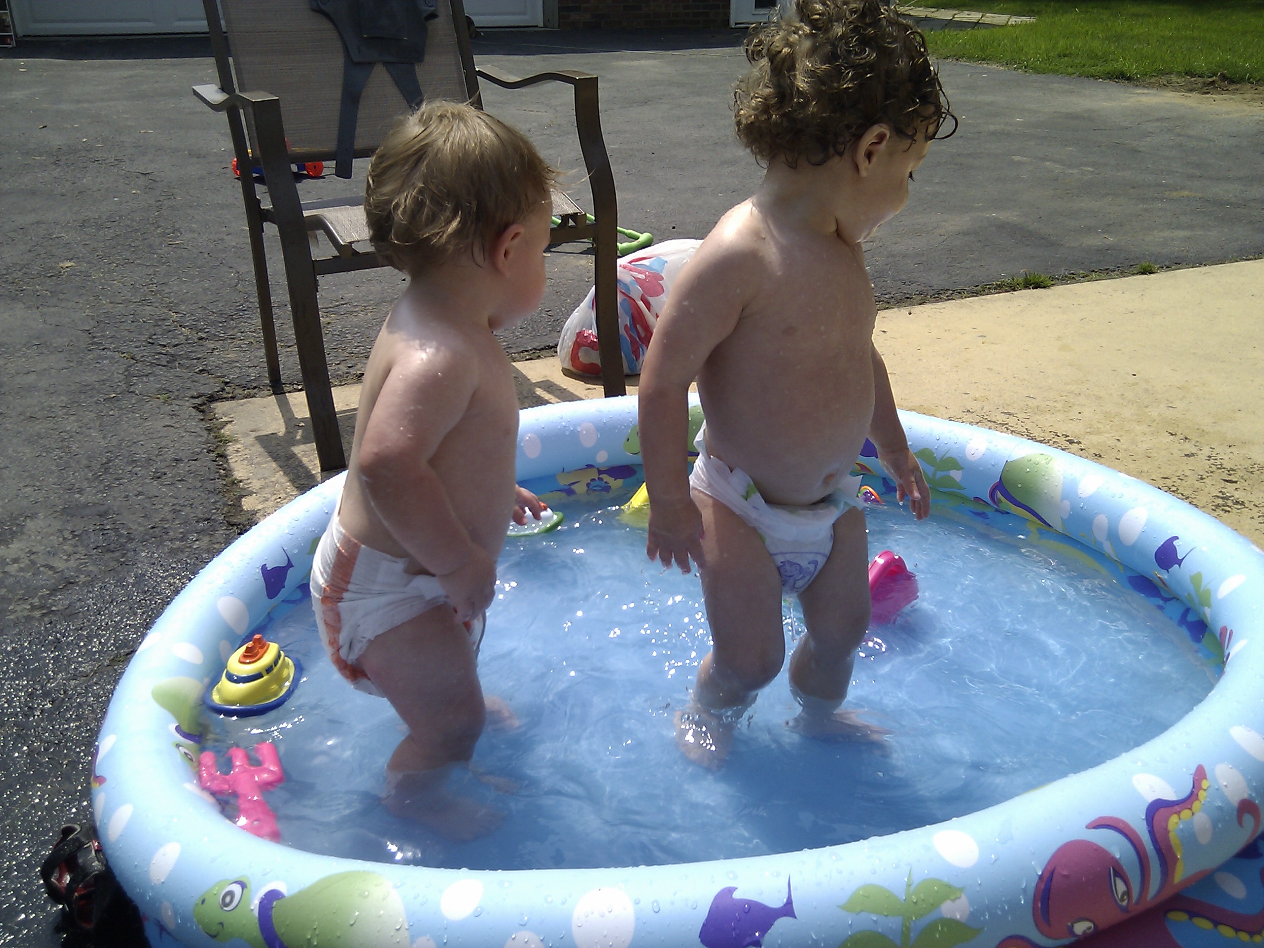 Mason and Caleb cooling off in the pool